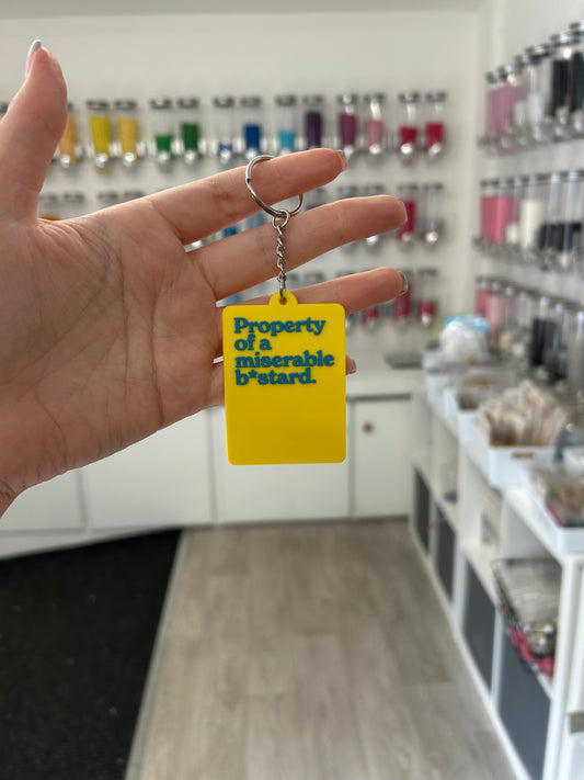 “Property of a miserable b*stard.” Keyring