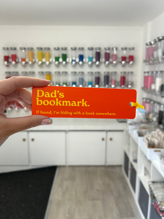 ‘Dad’s bookmark. If found, I’m hiding with a book somewhere’ Orange Bookmark